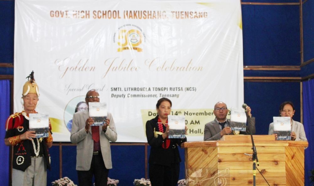 ADC Tuensang Thungchanbemo Tungoe with others releases the GHS Hakushang Jubilee Souvenir at Town Hall, Tuensang on November 14. (DIPR Photo)